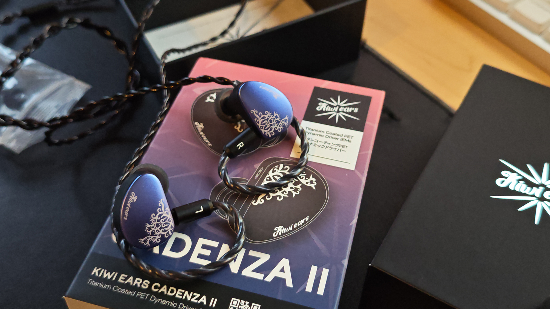 The Kiwi Ears Cadenza II in-ear monitors on a home desktop. 