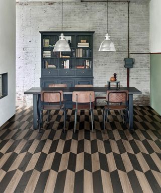 graphic black and wood chevron flooring in a contemporary blue kitchen from moduleo
