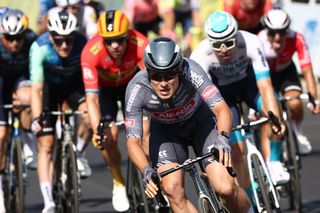 Alpecin-Deceuninck team's Belgian rider Jasper Philipsen (C) cycles past the finish line to win ahead of second-placed Bahrain - Victorious team's German rider Phil Bauhaus (R) and third-placed Uno-X Mobility team's Norwegian rider Alexander Kristoff (3rd L) during the 16th stage of the 111th edition of the Tour de France cycling race, 188,6 km between Gruissan and Nimes, southern France, on July 16, 2024. (Photo by Anne-Christine POUJOULAT / AFP)