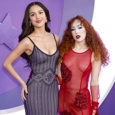 Olivia Rodrigo and Chappell Roan both wearing lingerie-inspired dresses for the premiere of the GUTS World Tour movie.