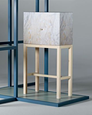 ‘Lenticular Cabinet’ features a holographic surface that shifts between pine and marble.