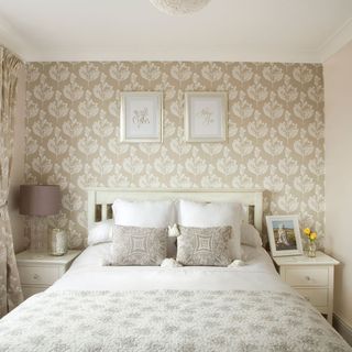 bedroom with printed wall and double bed
