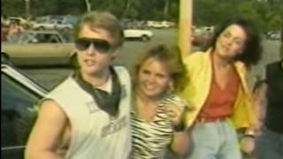 Three people being interviewed in Heavy Metal Parking Lot