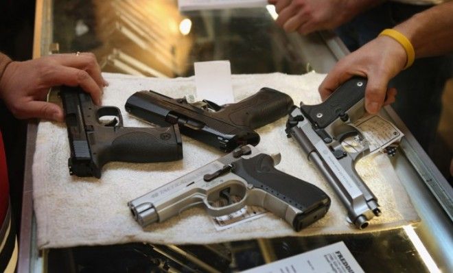 A customer shops for a new gun at a sporting goods store in Illinois on Jan. 19.