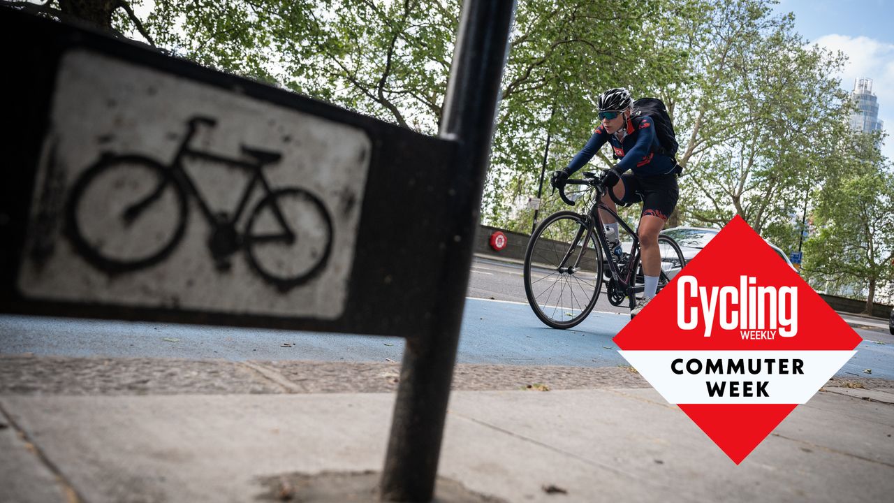 Cyclist rides in London with Commute Week roundel added