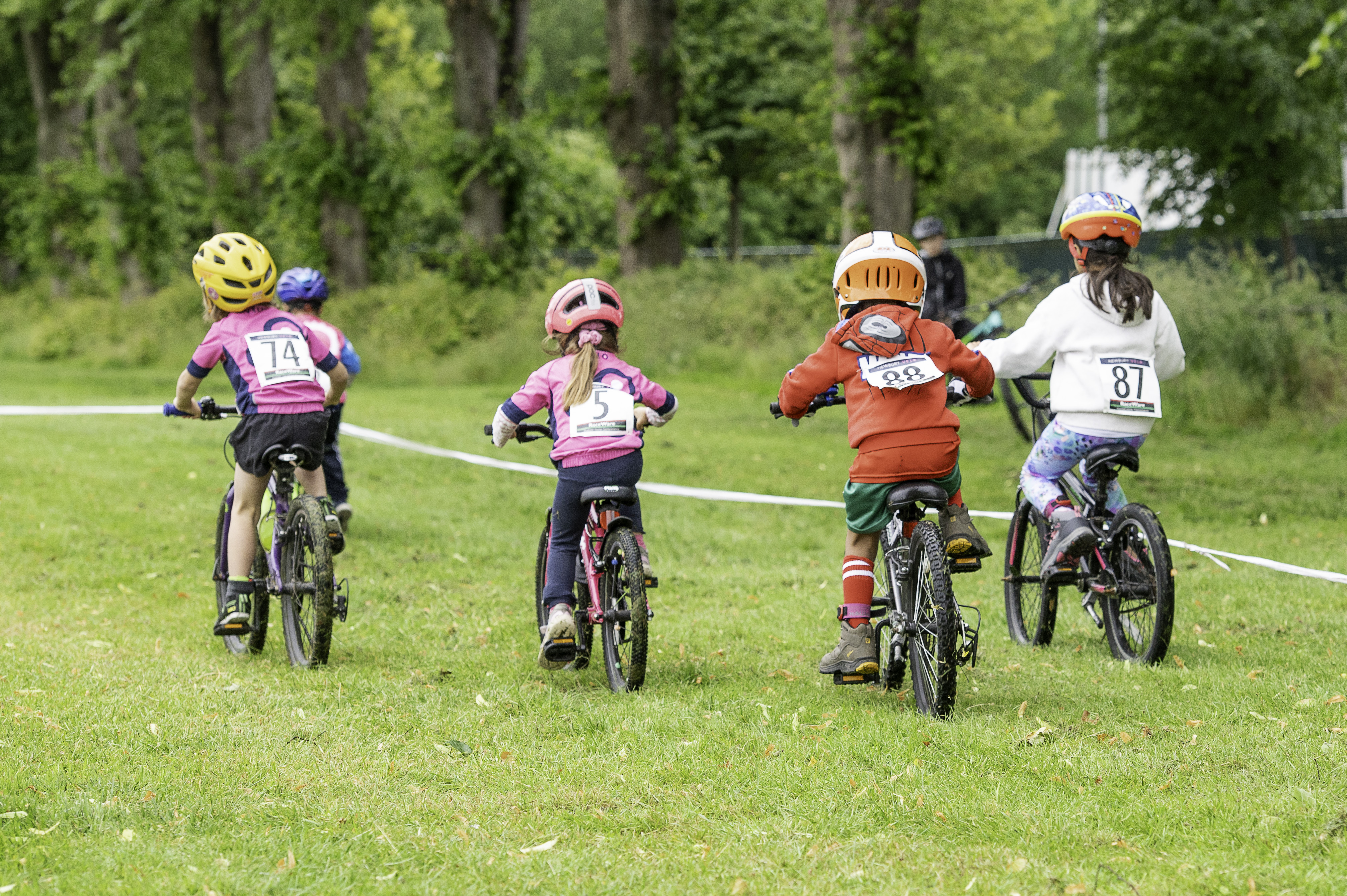 Newbury Velo kids riding on grass