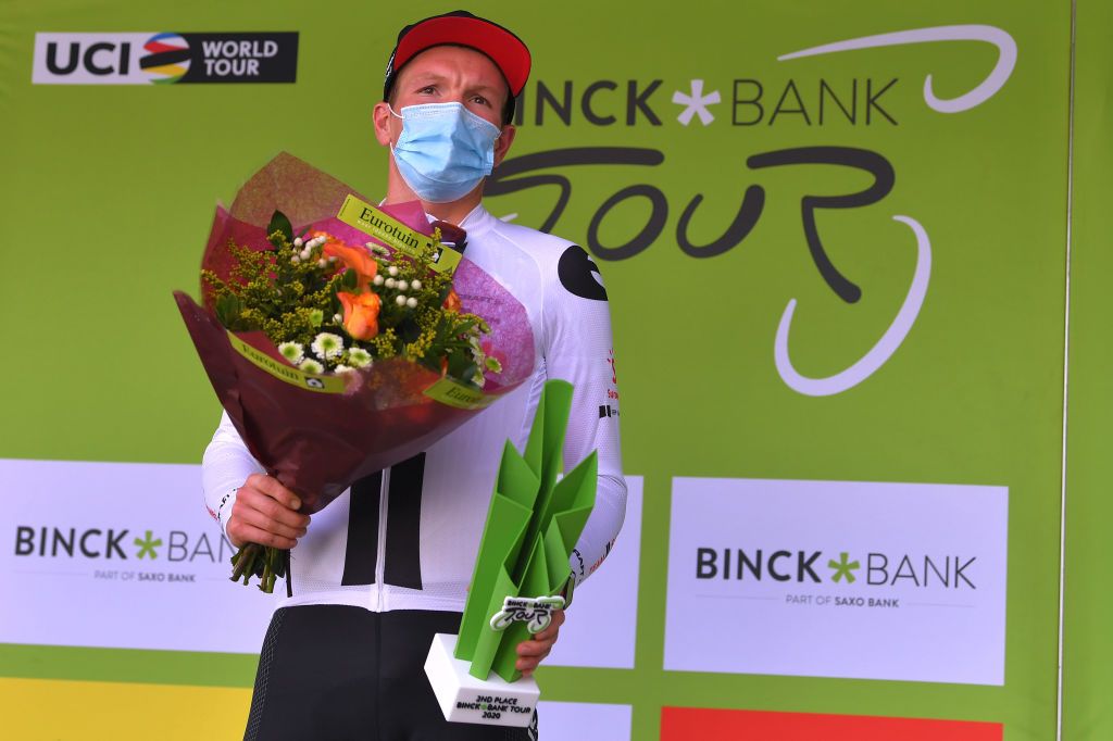 GERAARDSBERGEN BELGIUM OCTOBER 03 Podium Soren Kragh Andersen of Denmark and Team Sunweb Celebration Trophy Flowers Mask Covid safety measures during the 16th BinckBank Tour 2020 Stage 5 a 1836km stage from Ottignies Louvain la Neuve to Muur van Geraardsbergen 108m BinckBankTour BinckBankTour on October 03 2020 in Geraardsbergen Belgium Photo by Luc ClaessenGetty Images