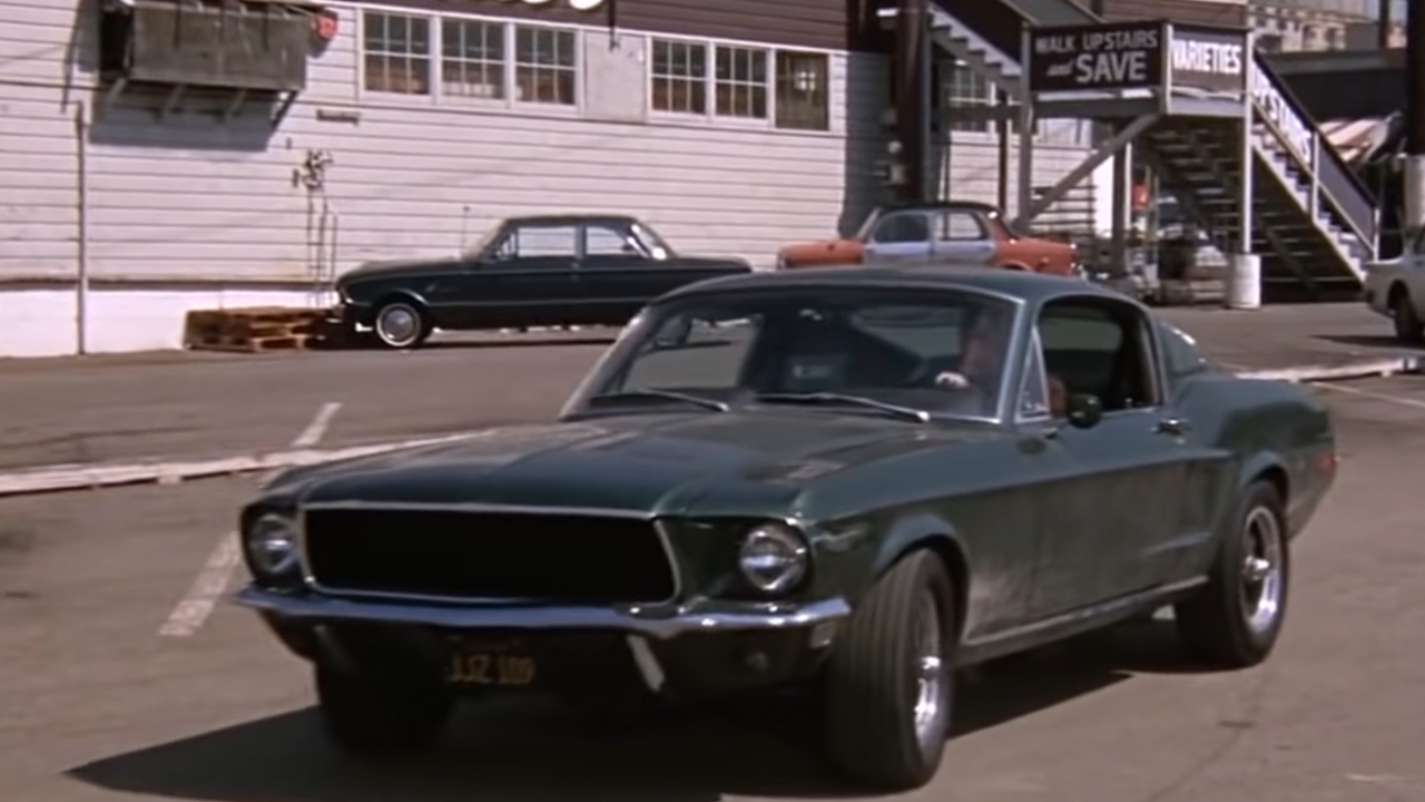 A green mustang seen from the front.