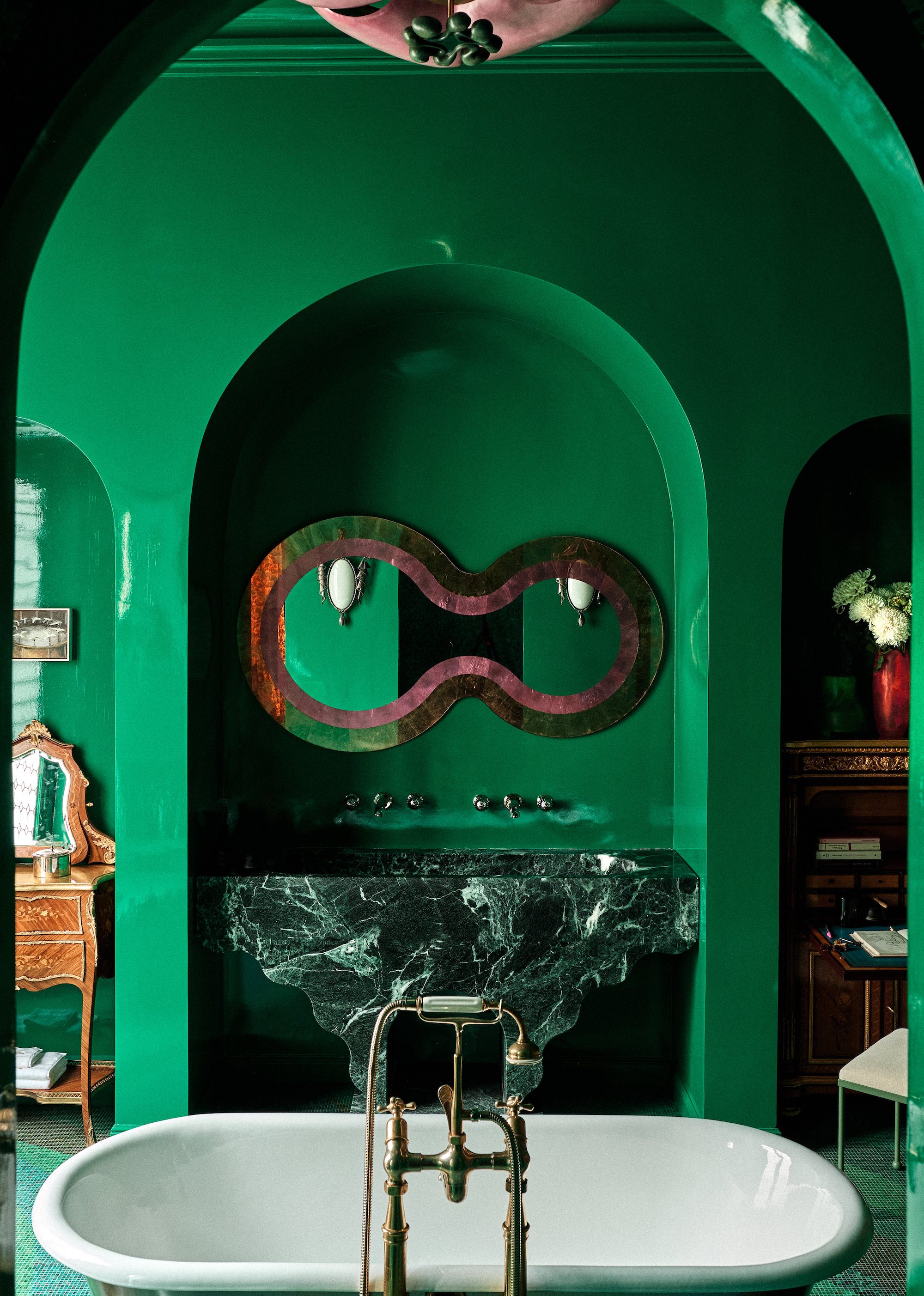 bathroom with emerald green walls and green marble vanity