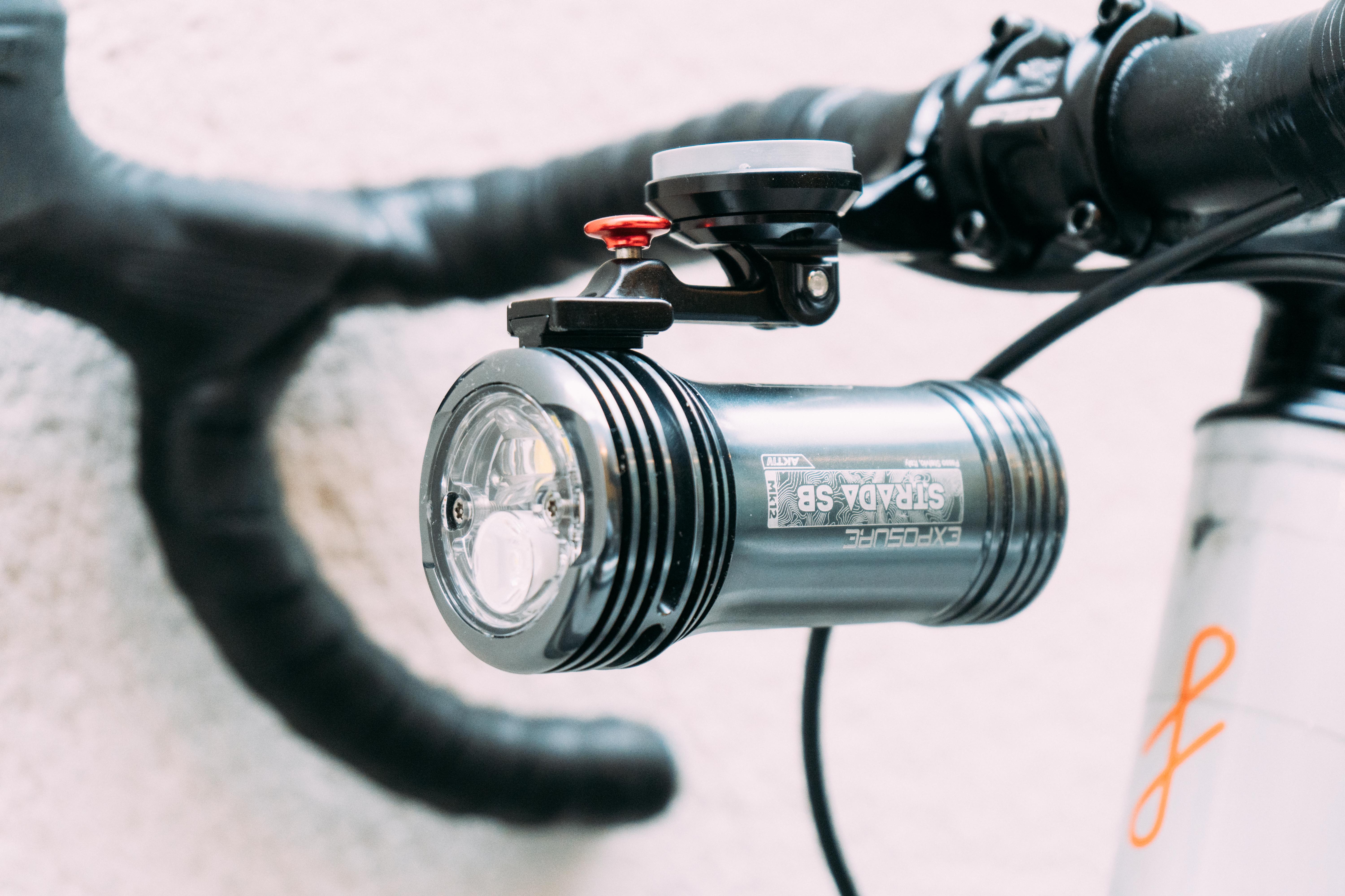 Close up details of the Exposure Lights Strada Mk12 RS AKTIV mounted on a handlebar
