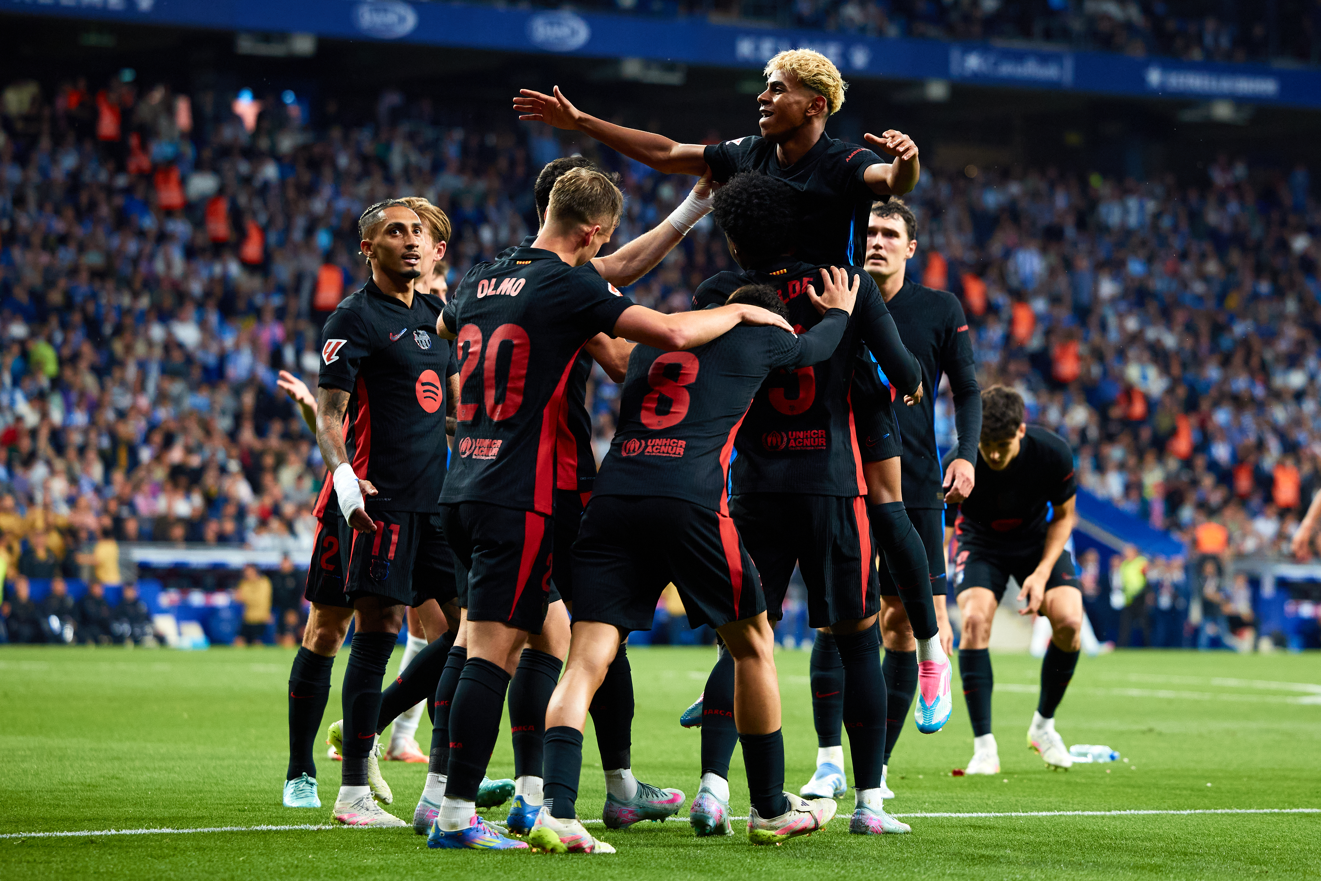 Lamine Yamal celebrates with his Barcelona team-mates after scoring against Espanyol in a 2-0 win which saw the Blaugrana clinch the La Liga title in May 2025.