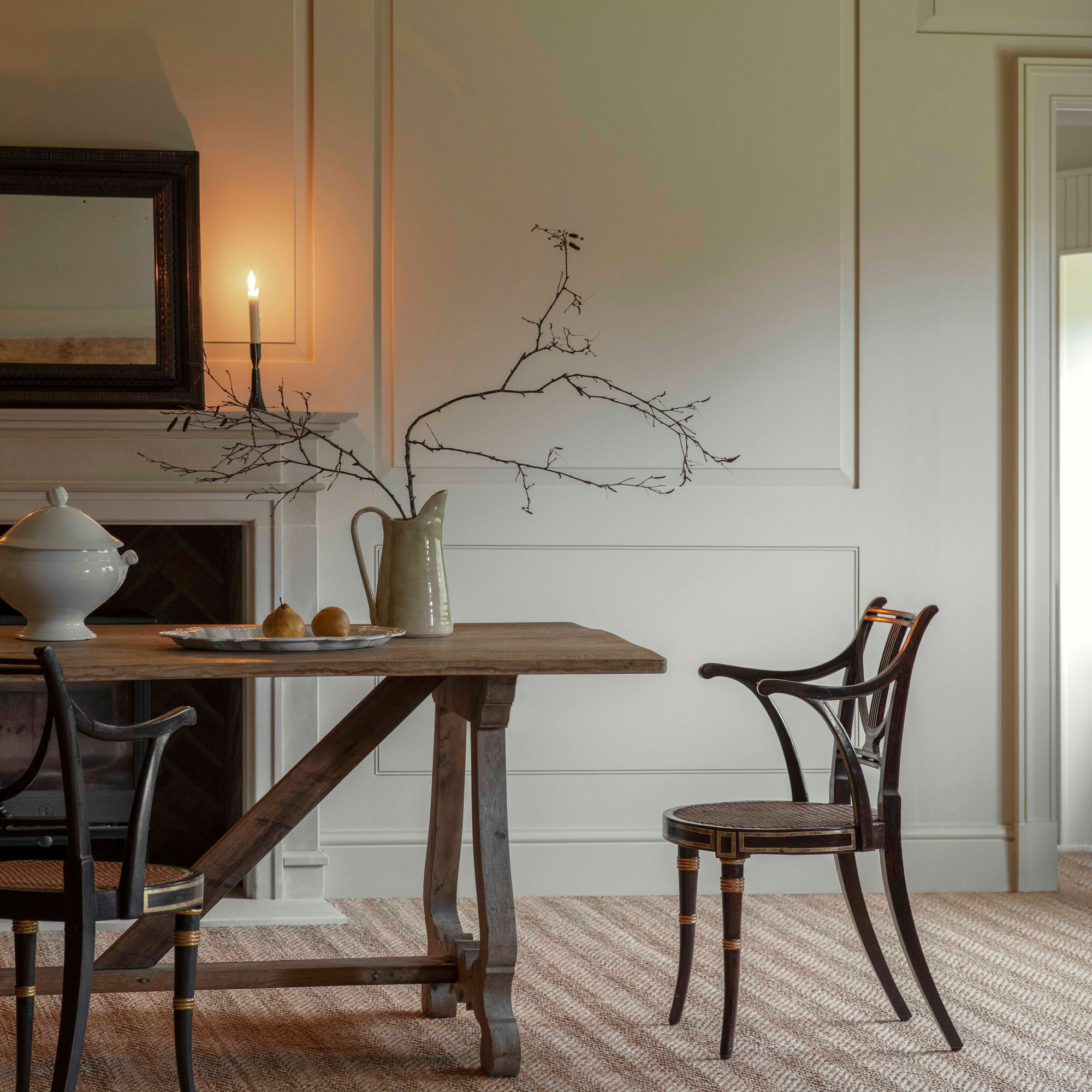 cosy dinging room with striped carpet and cream wall panelling