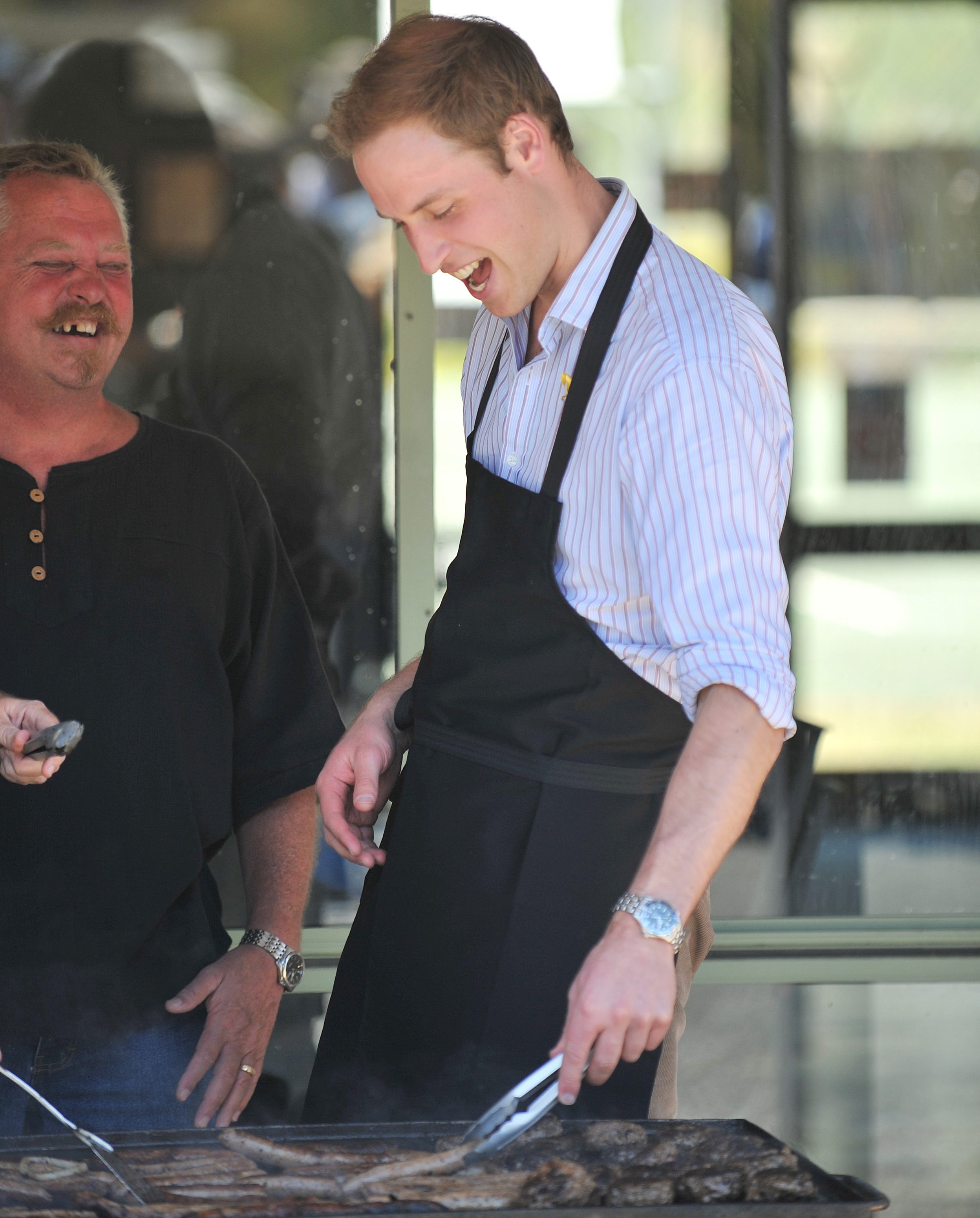 FLOWERDALE, AUSTRALIA - JANUARY 21: HRH Prince William helps out wiht a BBQ at the Flowerdale community event on the third and final day of his unofficial visit to Australia on January 21, 2010 in Flowerdale, Australia. HRH undertook numerous engagements during his 3 day Official visit to New Zealand, before arriving for a further 3 days in Australia 2 days ago. This is the second visit by the second-in-line to the throne, having been here at the age of 9 months with his parents in 1983. (Photo by Samir Hussein/WireImage)