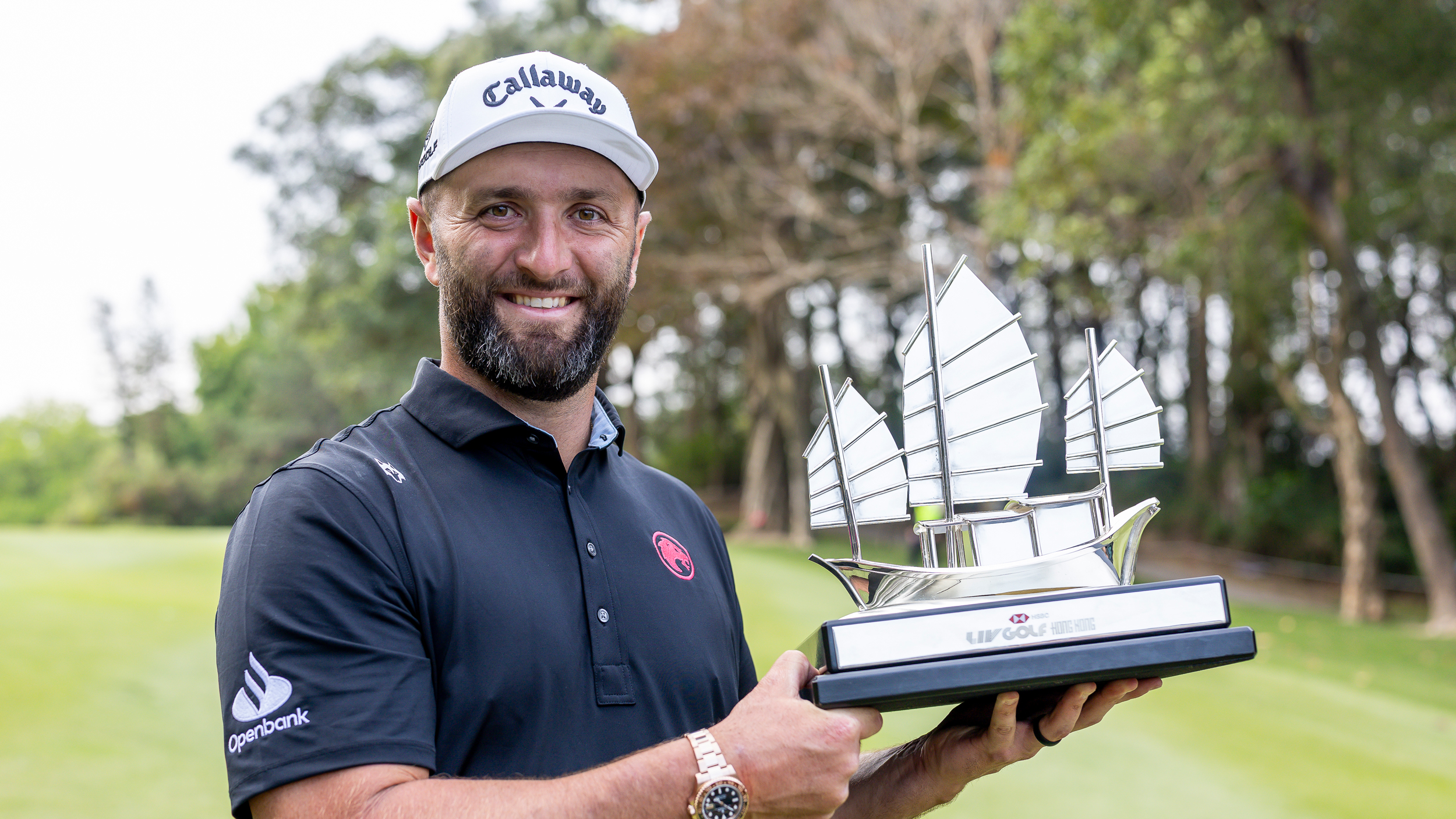 Jon Rahm poses with the LIV Golf Hong Kong trophy after his win in 2026