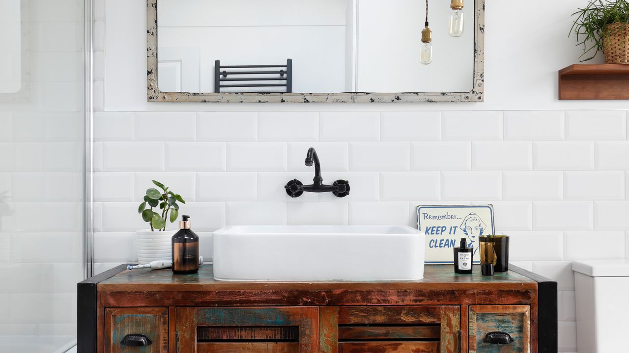 a bathroom with white tiles