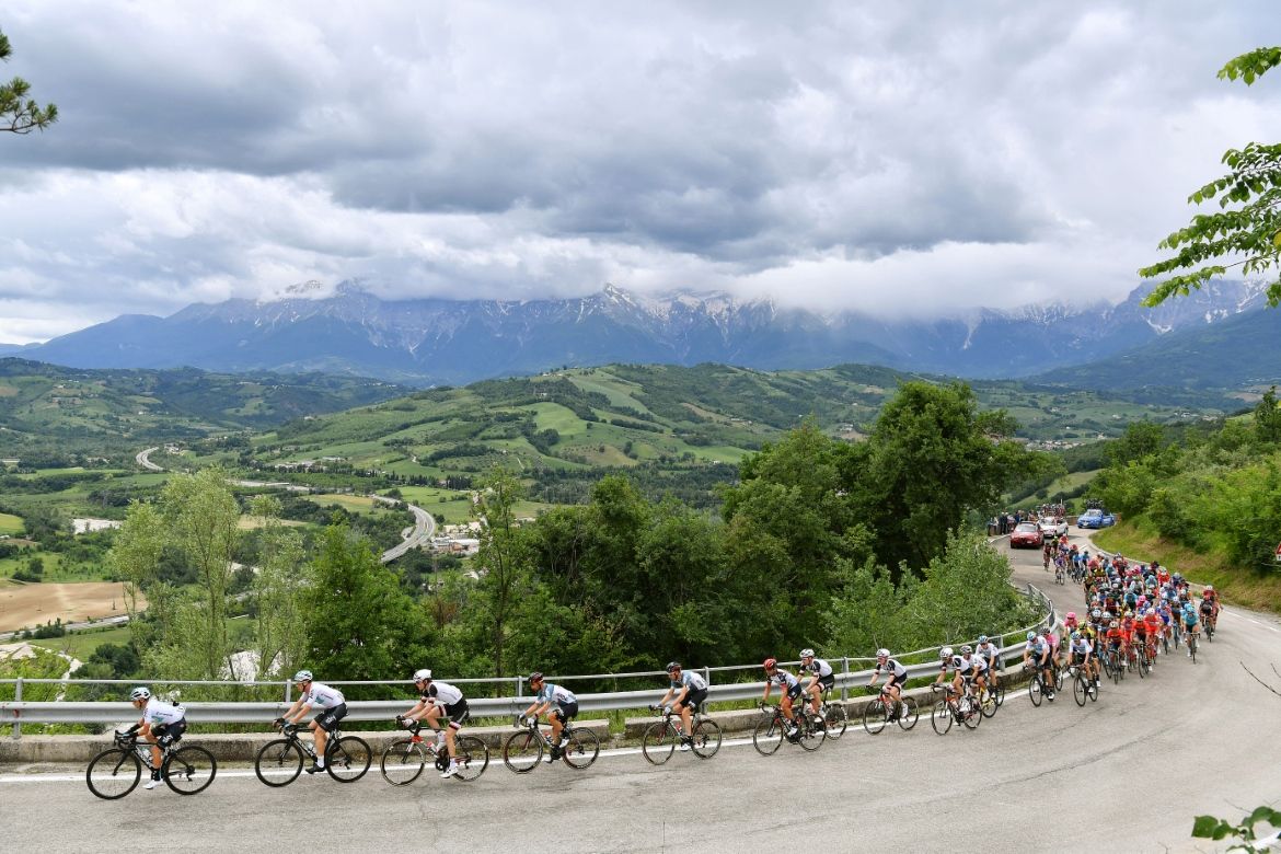 Grey clouds loom over the riders