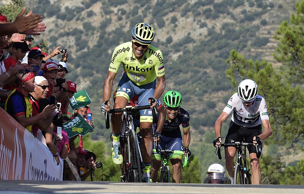 Tinkoff's Spanish cyclist Alberto Contador (L), Movistar's Colombian cyclist Nairo Quintana (C) and Sky's British cyclist Christopher Froome compete to reach the finish line of the 17th stage of the 71st edition of 'La Vuelta'
