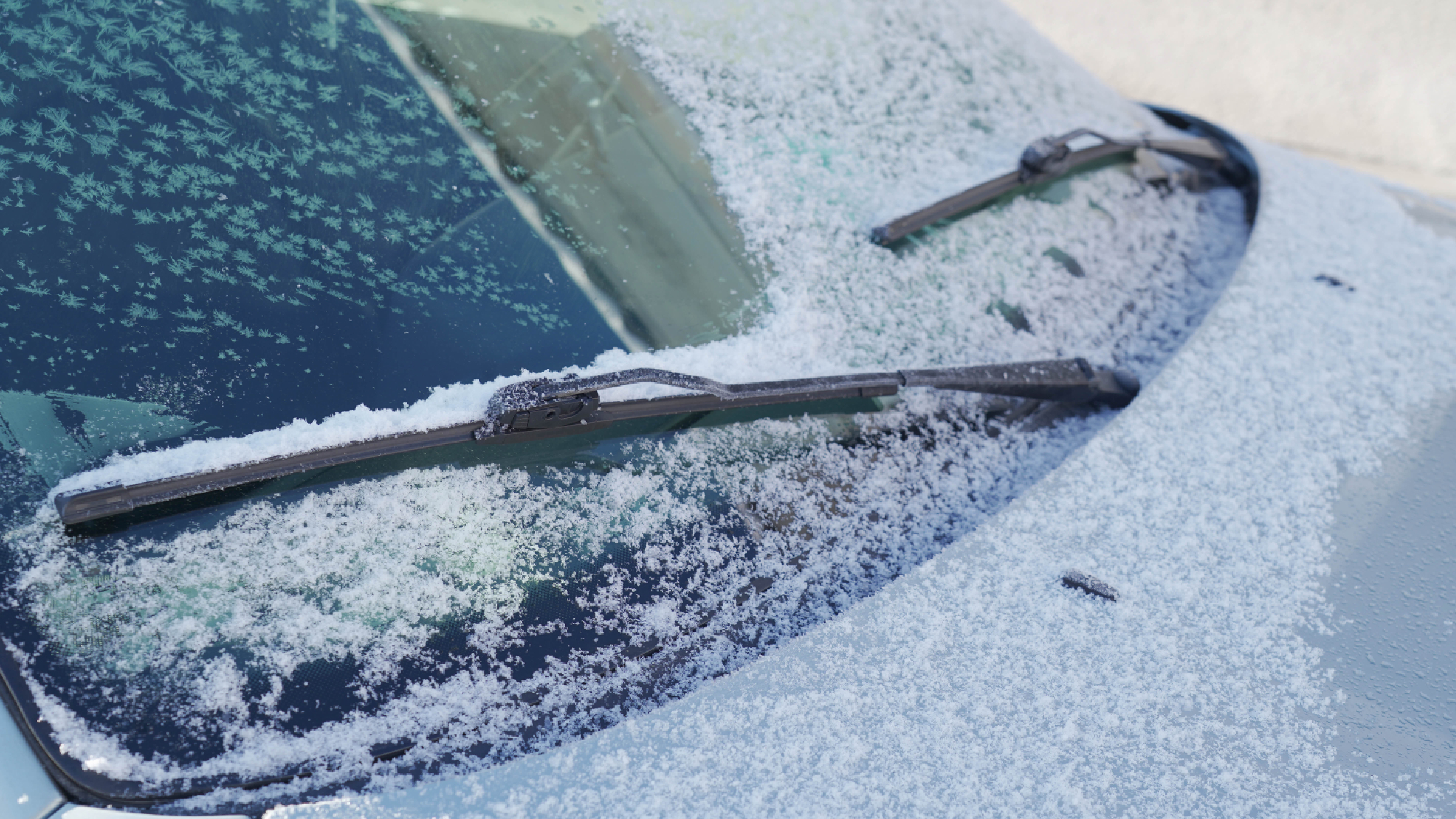 Windscreen wipers sweeping snow