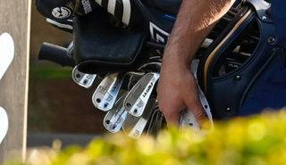 A close-up of Bryson DeChambeau's LA Golf irons