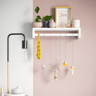 Ikea spice rack used as a bedroom shelf and to hang necklaces