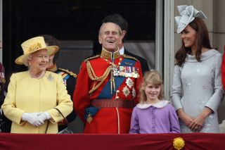 Queen Elizabeth II, Prince Philip, Duke of Edinburgh, Lady Louise Windsor and Catherine, Duchess of Cambridge arrive on the balcony of Buckingham Palace