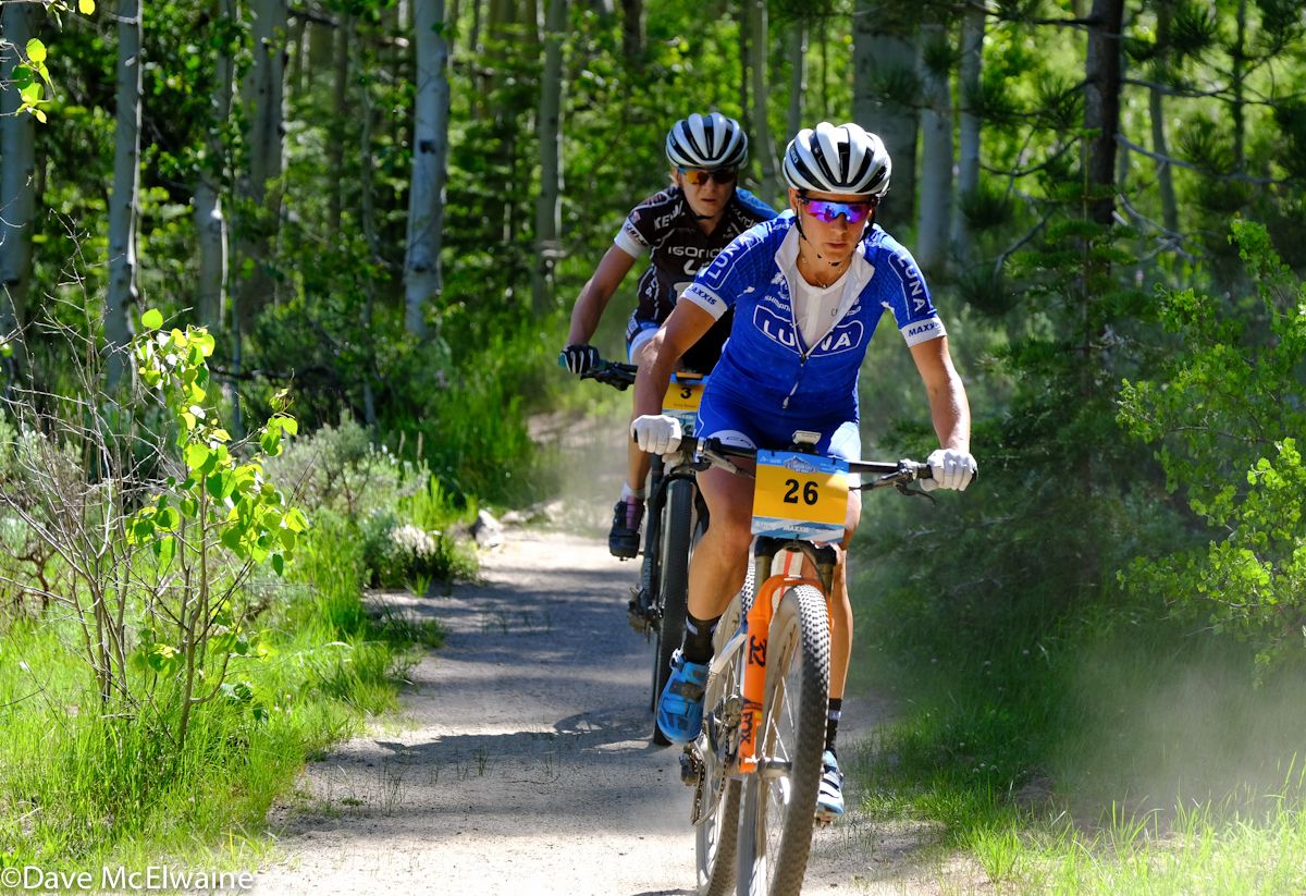 Katerina Nash (Luna Pro Team) following Rose Grant at the ten-mile point