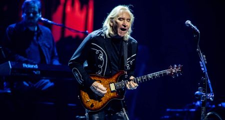 Joe Walsh plays a PRS SE electric guitar live onstage