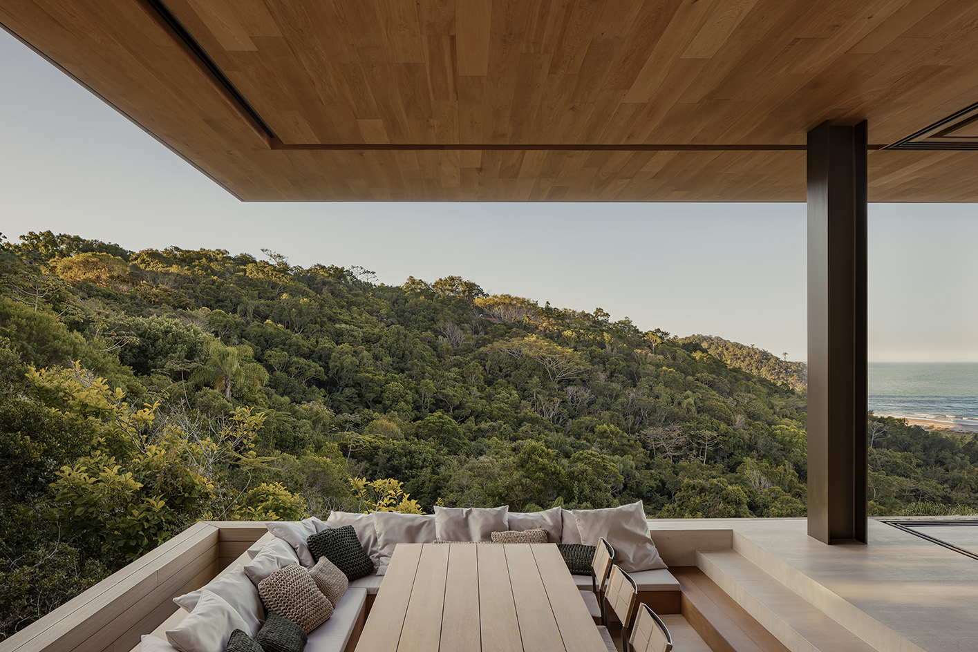 Bravissima House by Arthur Casas, a brazilian house nestled among the forest canopy and rising above the foliage to long views from large windows and ample terraces