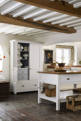 freestanding kitchen cabinetry in white and wood kitchen