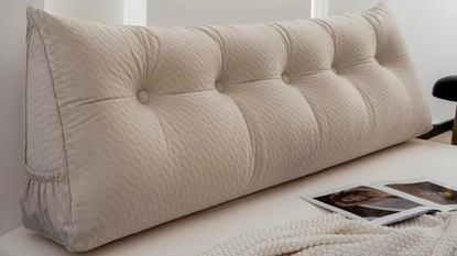 Beige large wedge pillow with tufted buttons