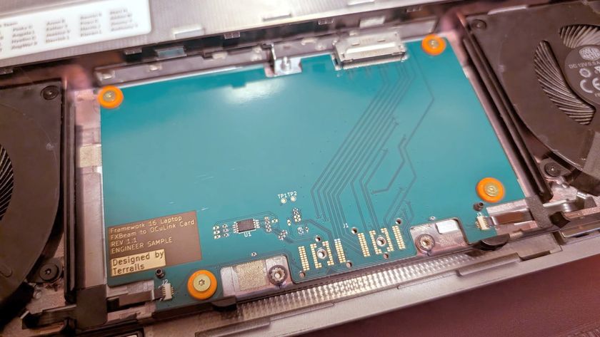 A photo of an adapter board adding OCuLink connections to a Framework Laptop 16.