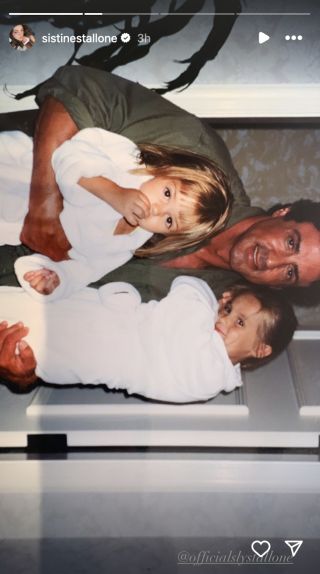 Sylvester Stallone holds two of his kids in photo
