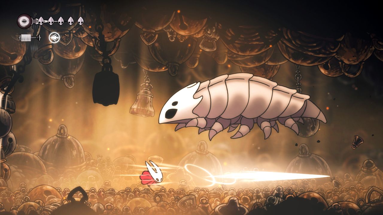Hollow Knight: Silksong gameplay showing second boss Bell Beast leaping at Hornet