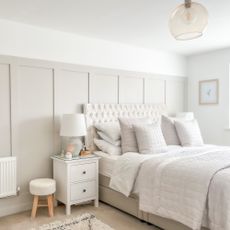 bedroom with wall panelling and neutral colour scheme