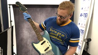 Mike Adams holding Kurt Cobain&#039;s Smells Like Teen Spirit Fender Mustang