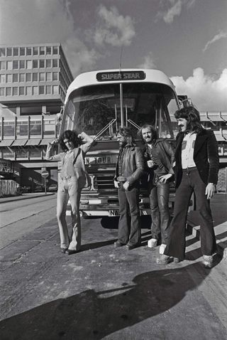 Nazareth standing at the front of their tour bus in 1973