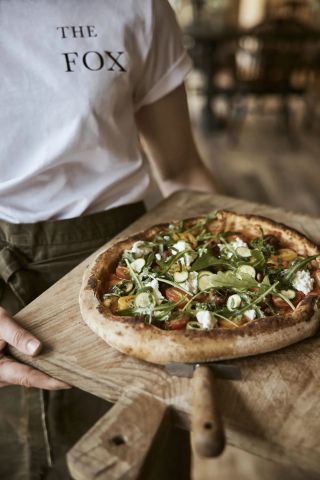 Pizza on wooden board