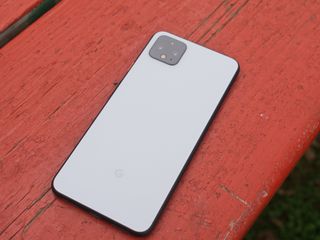 Pixel 4 XL lying on a red picnic table