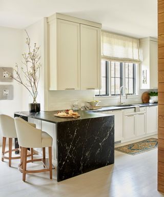 White and black marble kitchen with gold bar handles