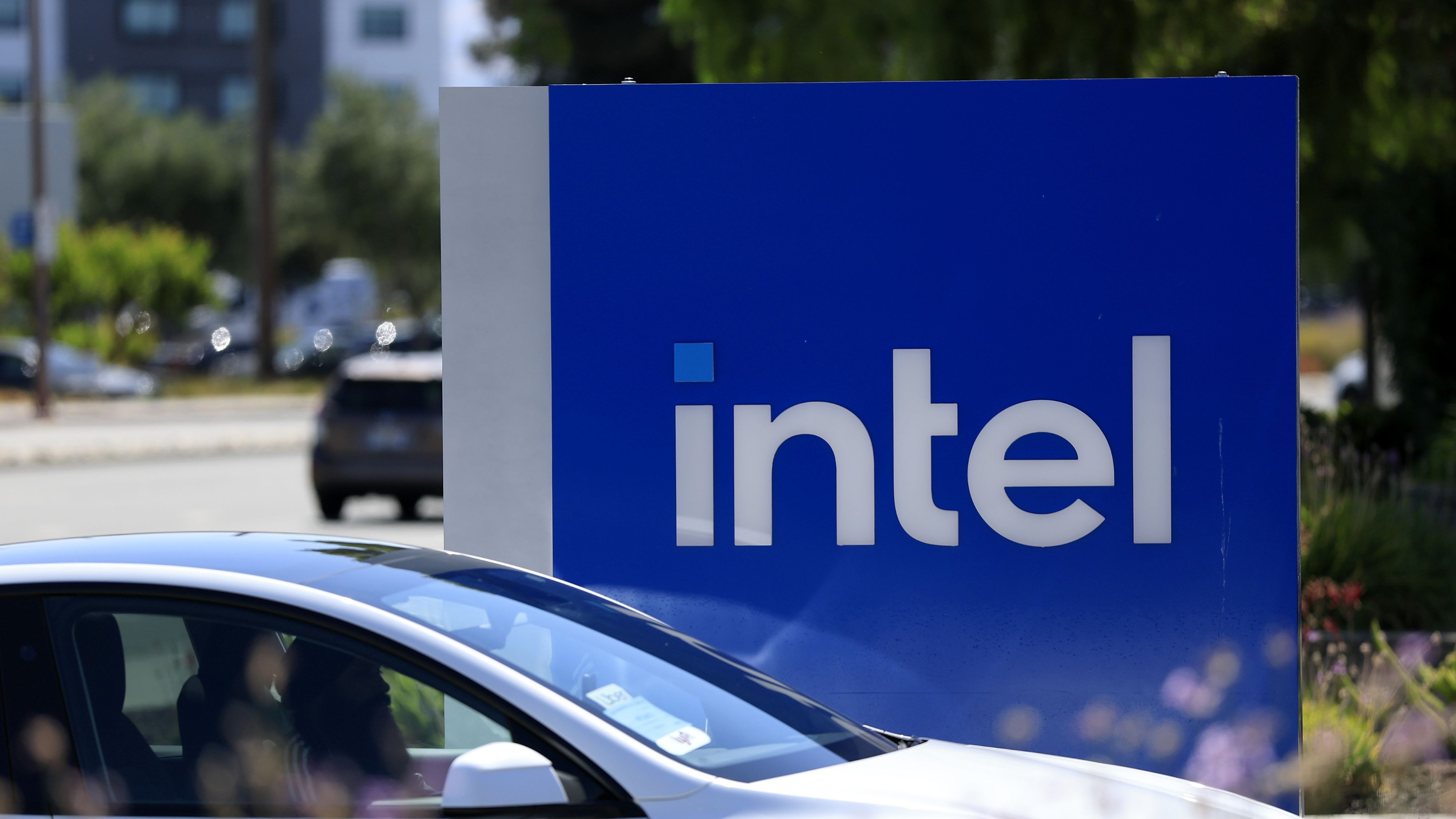 The Intel logo is displayed on a sign in front of Intel headquarters on July 16, 2025 in Santa Clara, California.