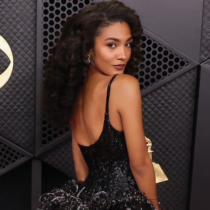 Olivia Dean arrived at the 2026 Grammys in a custom black-and-white Chanel gown