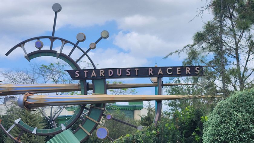 The green celestial sign outside of Stardust Racers at Universal Orlando. 