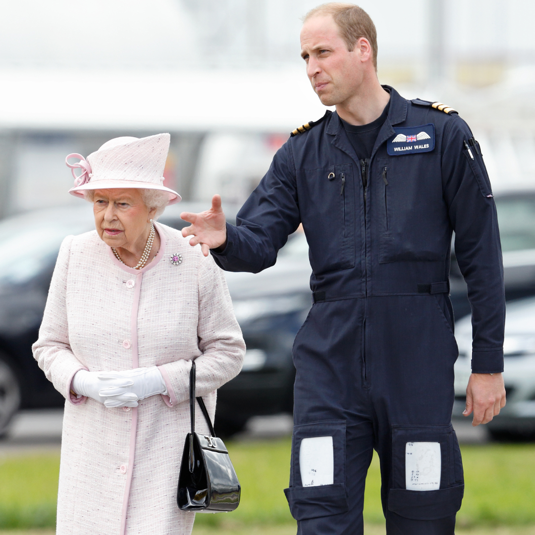 Queen Elizabeth wears a light pink coat and matching hat and carries a black leather handbag, while her grandson Prince William wears his Royal Air Force uniform and guides her around