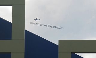 Art banner trailed from airplane