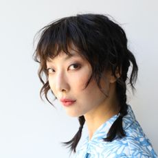 girl with bangs, one of the 2023 hair trends