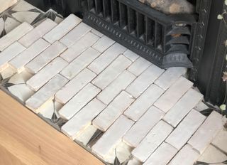 dry fixing the fireplace tiles