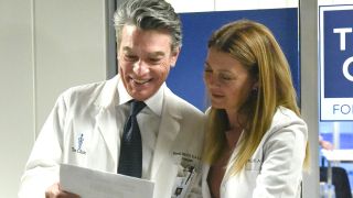 Meredith Grey and David Hamilton look at results on Grey's Anatomy.