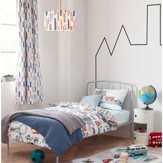 kids room with white wall bed and toys