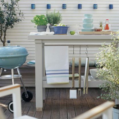 arden furniture, kitchen island, utensils, bbq, barbecue, alfresco, wooden decking, herbs, plants, lanterns, 