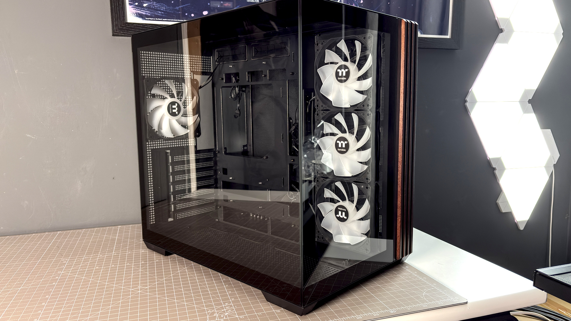 The Thermaltake View 380 WS ARGB on a desk with various components fitted.